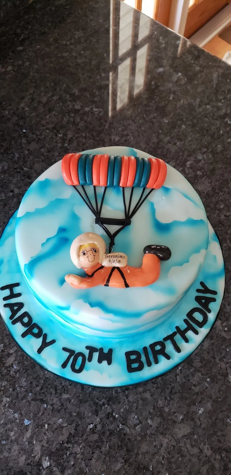 Skydiving themed seventieth birthday cake with a hand modelled parachutist