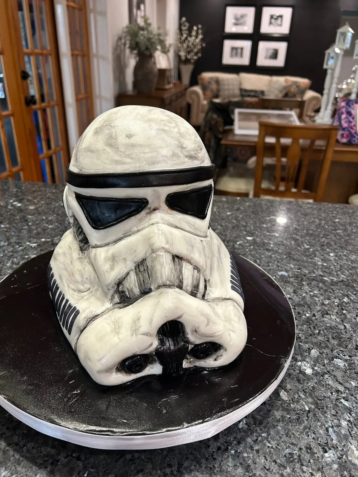 Sculpted Star Wars stormtrooper helmet cake in white fondant