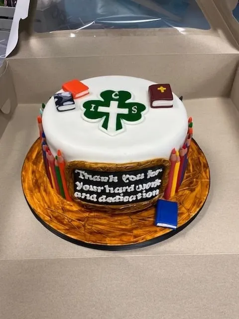 Teacher appreciation cake with fondant books, apple and hand painted wood grain